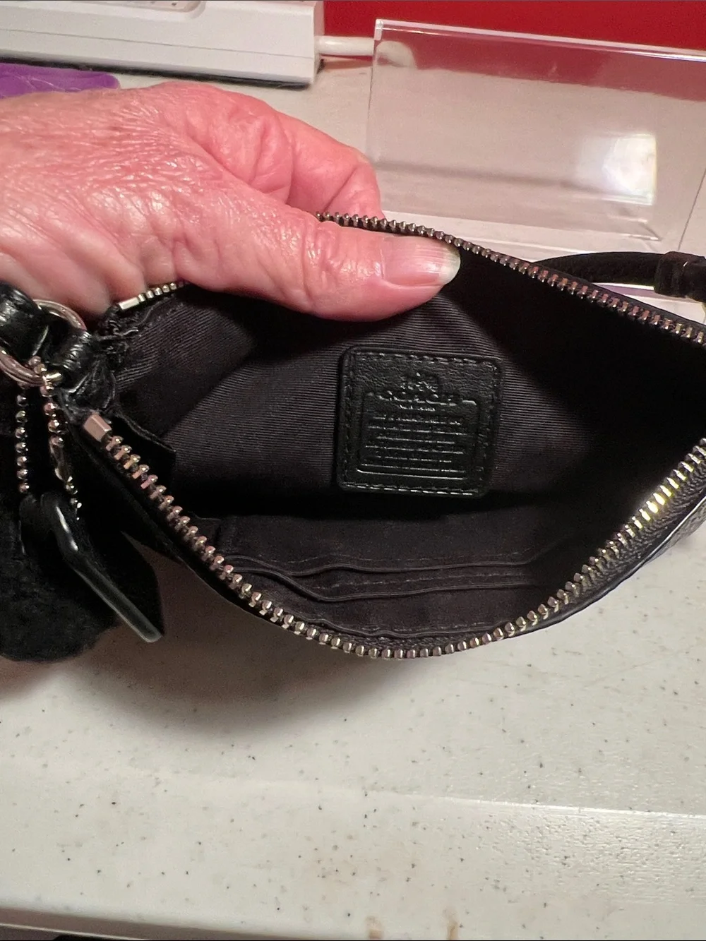 Coach Black Pebbled Leather Shearling-Trim Wristlet